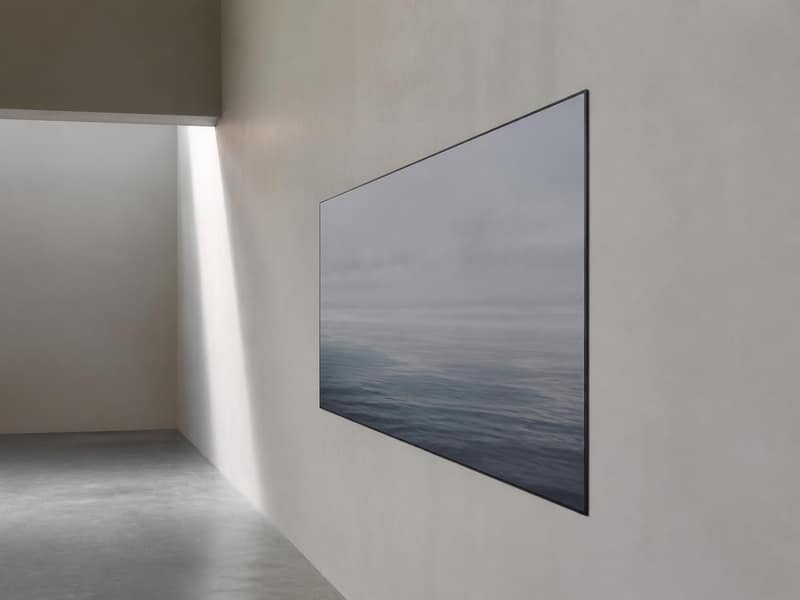 Flat-screen television sitting flush to a wall on a low-profile fixed mount